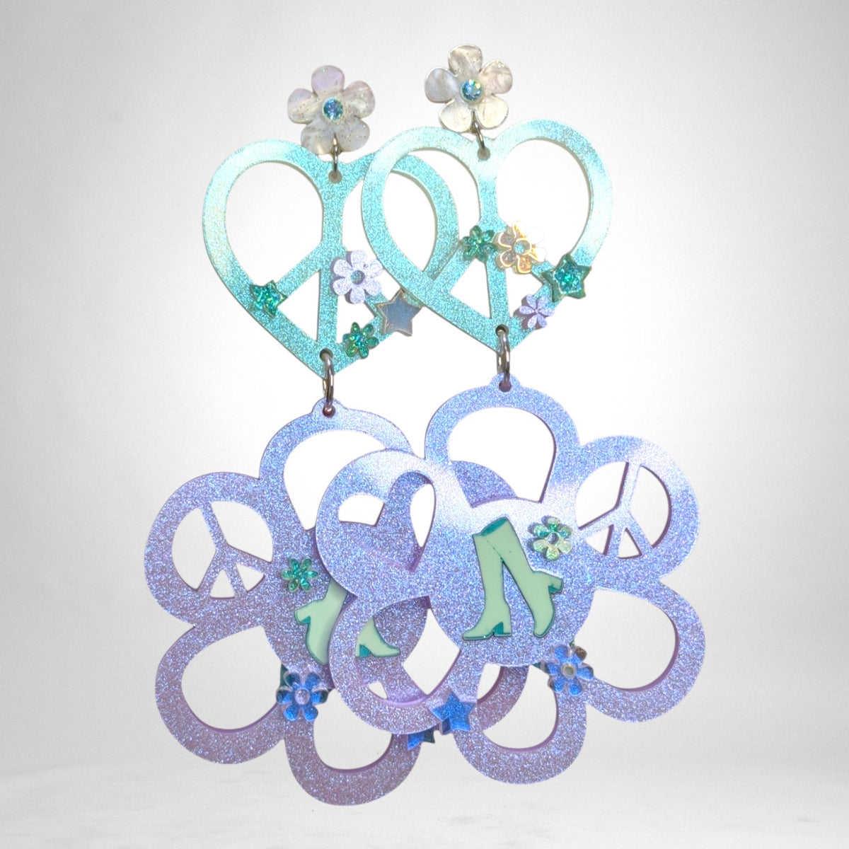 12th Ave Design Co. custom KOHH earrings featuring iridescent glitter heart and flower peace sign charms.