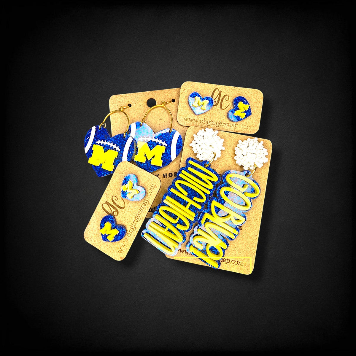 12th Ave Design Co. custom Michigan themed earrings featuring blue and yellow heart and Go Blue statement designs.