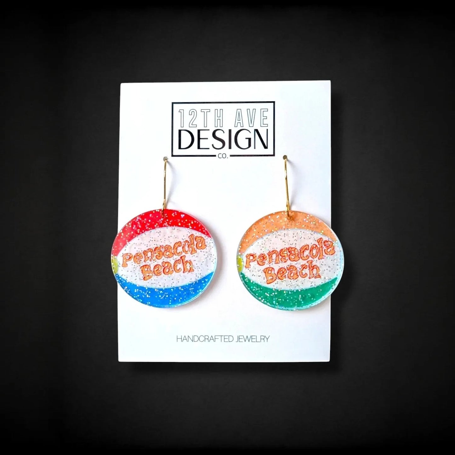 12th Ave Design Co. Pensacola Beach ball earrings made of lightweight glittered acrylic with gold plated hooks.