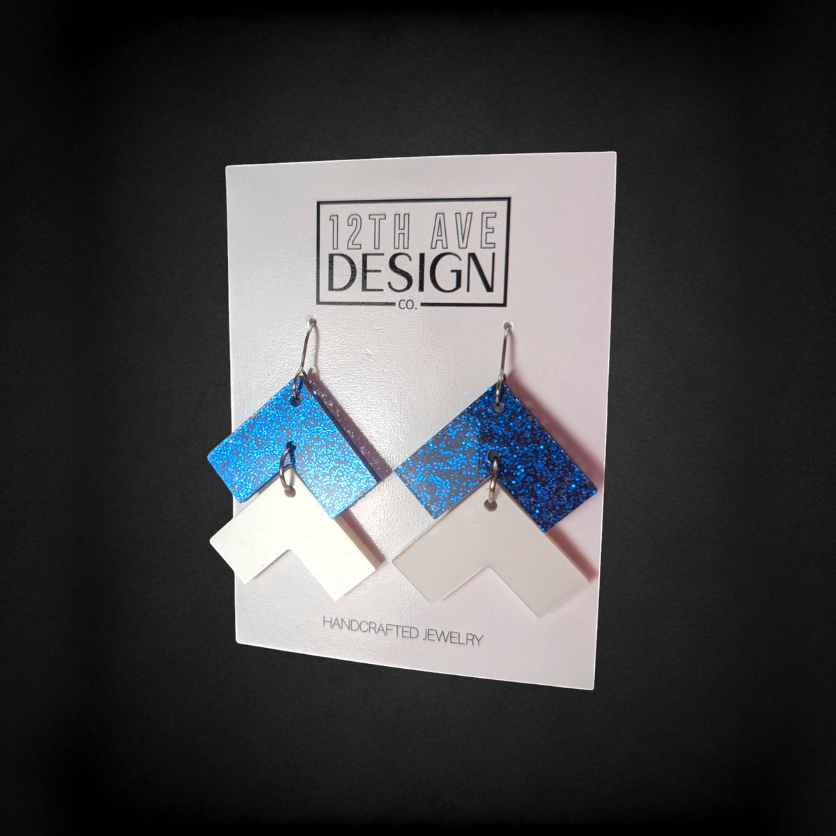 12th Ave Design Co. blue glitter and white chevron drop earrings on surgical steel hooks