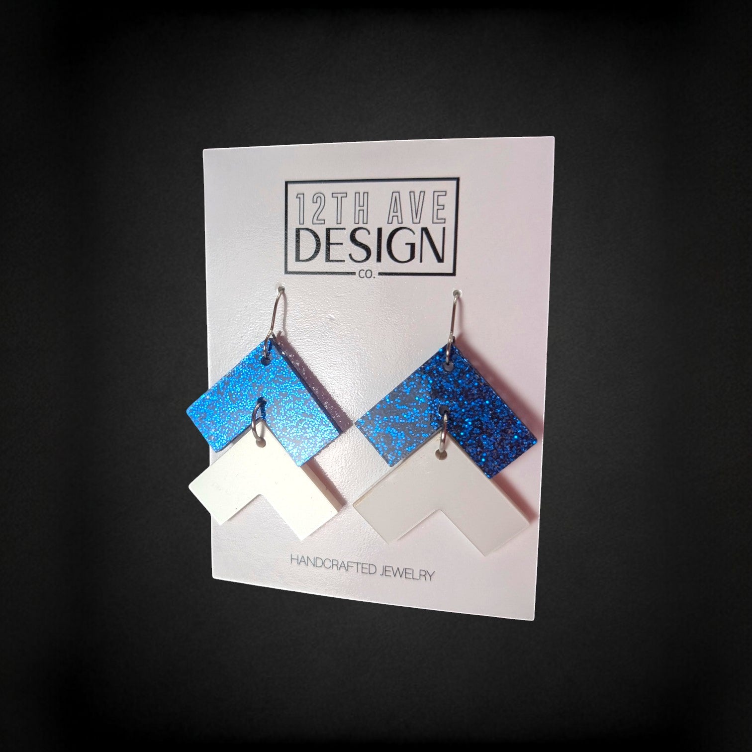 12th Ave Design Co. blue glitter and white chevron drop earrings on surgical steel hooks