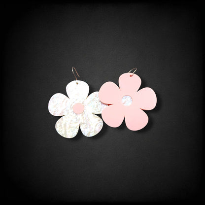 12th Ave Design Co. Bubble Daisy earrings featuring one iridescent white and one matte pink flower on metal hooks.