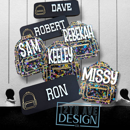 12th Ave Design Co. custom acrylic backpack keychains and name tags with glitter accents and personalized names.