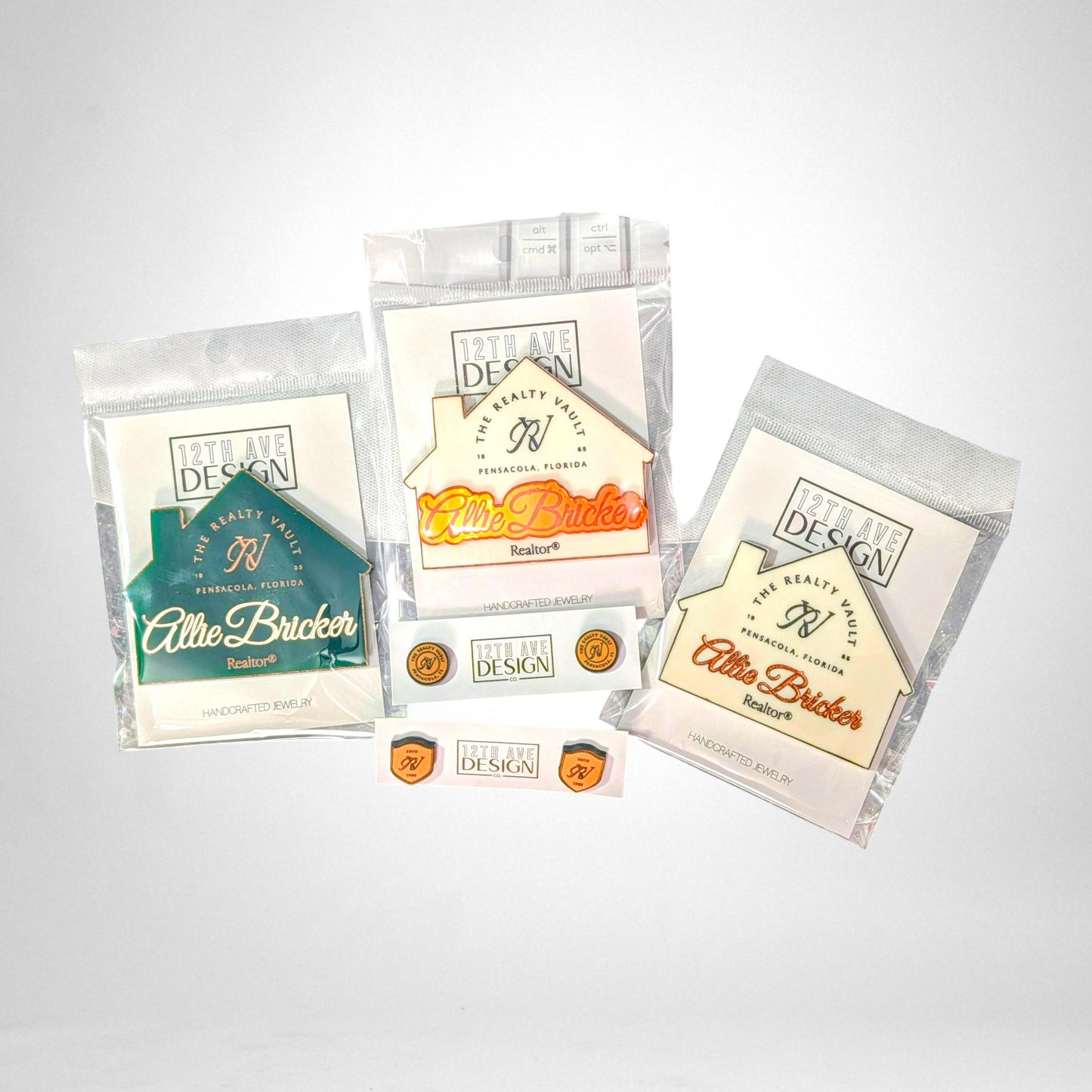 12th Ave Design Co. custom house-shaped acrylic name tags with engraved realtor branding in various colors