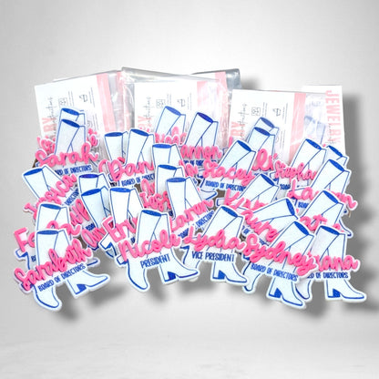 12th Ave Design Co. custom glittery white and blue cowboy boot nametags with pink script names for a group event.