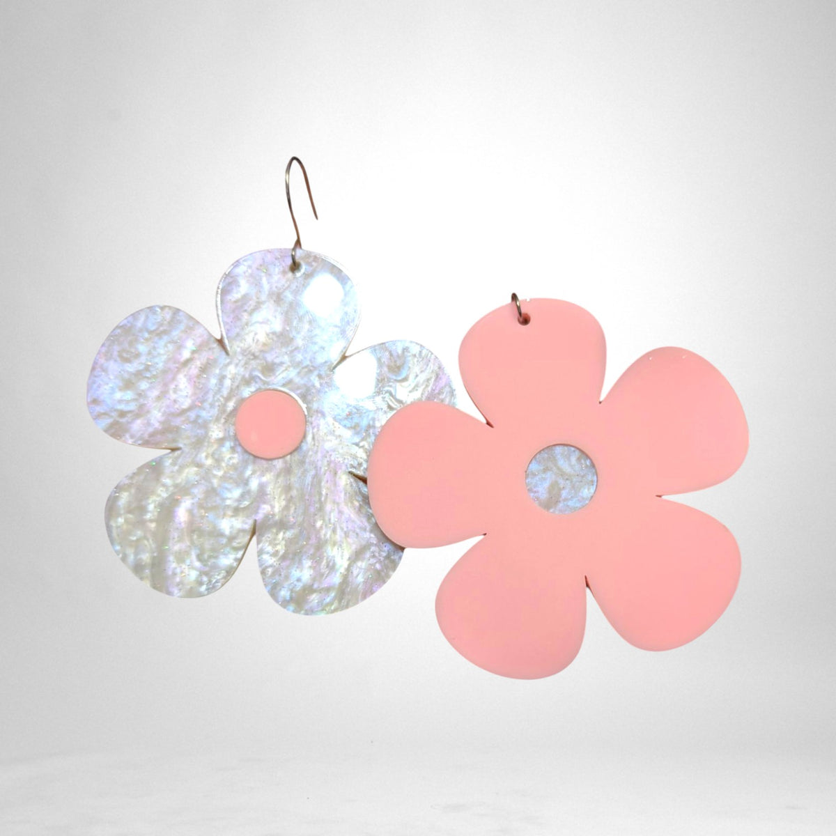 12th Ave Design Co. custom flower earrings with one iridescent pearlescent petal and one matte pink petal design.