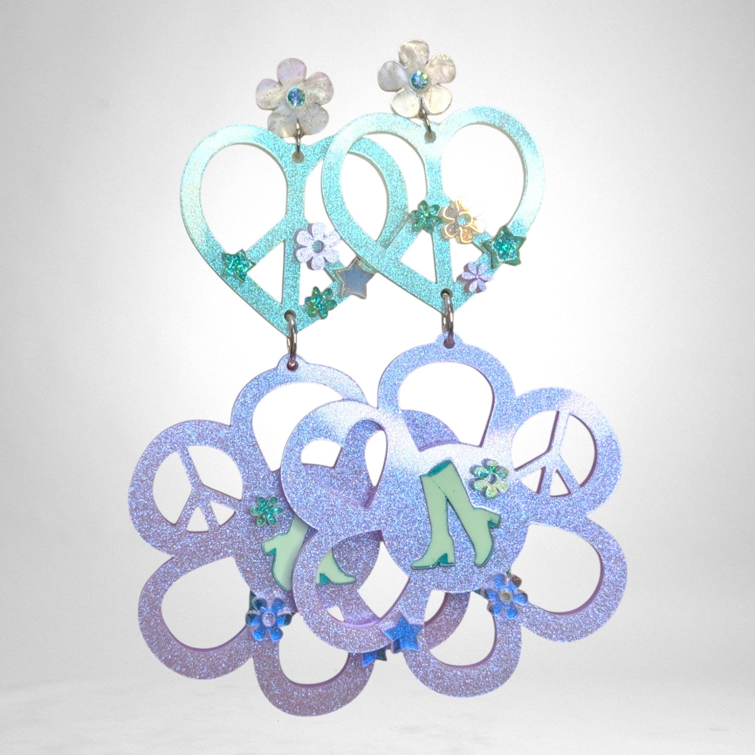 12th Ave Design Co. custom KOHH earrings featuring iridescent glitter heart and flower peace sign charms.