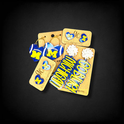 12th Ave Design Co. custom Michigan themed earrings featuring blue and yellow heart and Go Blue statement designs.