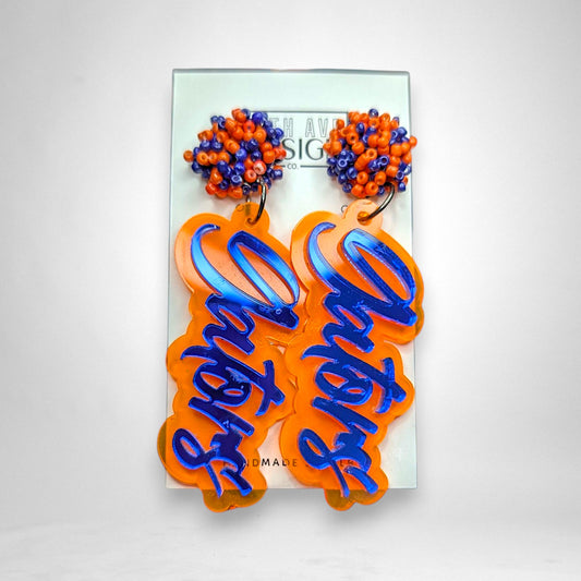 12th Ave Design Co. layered acrylic Gators earrings with orange and blue seed bead pom studs on stainless steel posts.