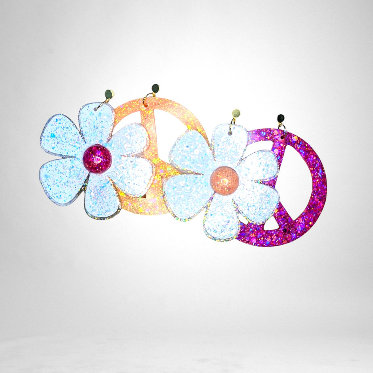 12th Ave Design Co. custom glittery flower and peace sign earrings in white, orange, and pink acrylic.