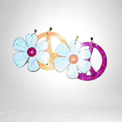 12th Ave Design Co. custom glittery flower and peace sign earrings in white, orange, and pink acrylic.