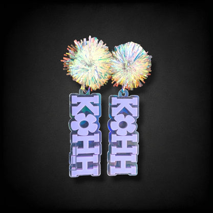 12th Ave Design Co. KOHH Varsity Bloom earrings featuring iridescent acrylic pom-poms and engraved lettering.