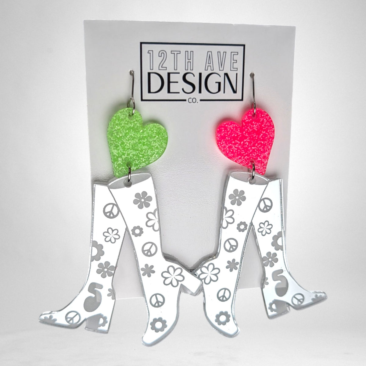12th Ave Design Co. custom earrings featuring mirrored silver go-go boots with floral and peace sign accents