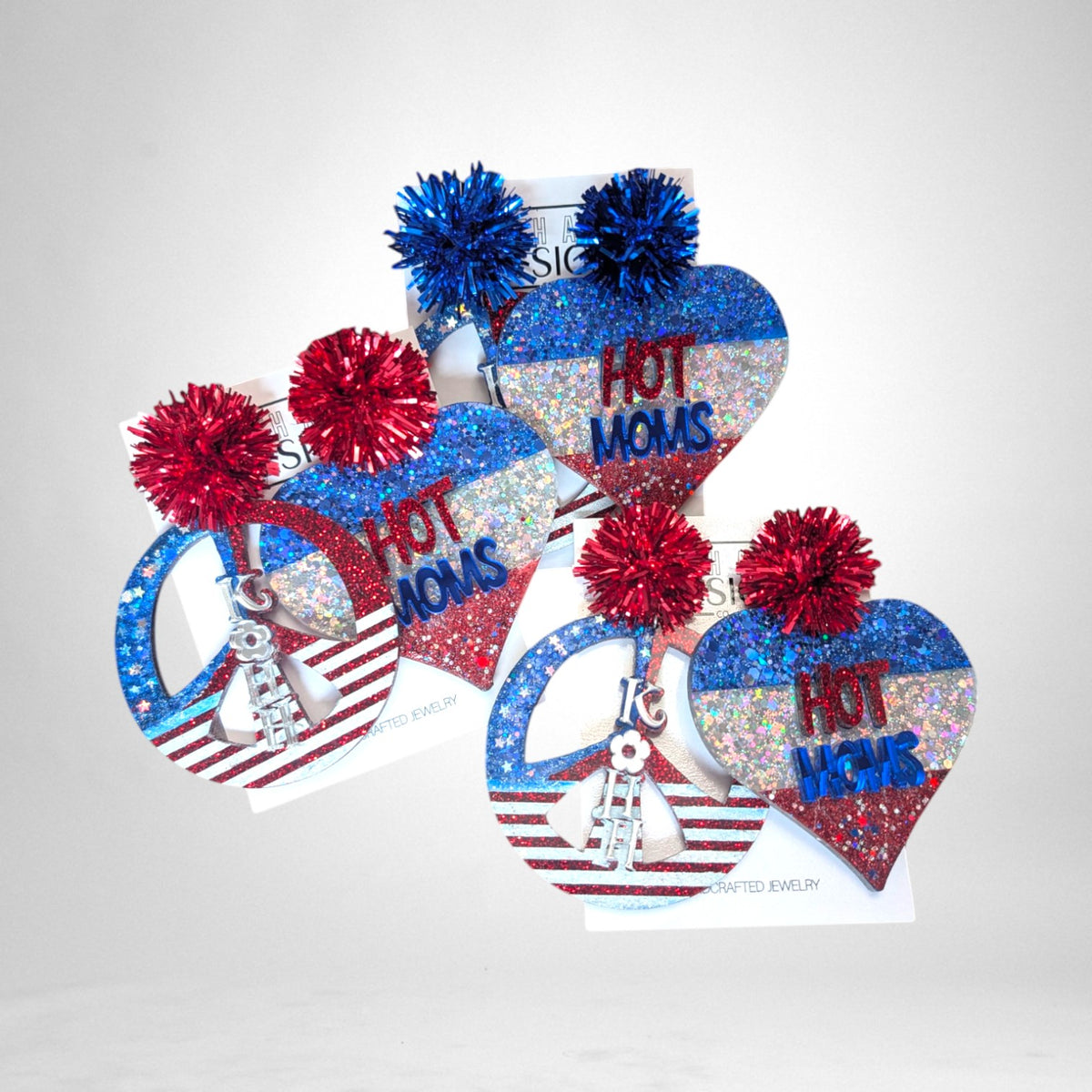 12th Ave Design Co. custom patriotic heart and peace sign earrings with glitter, red and blue pom-poms, and text.