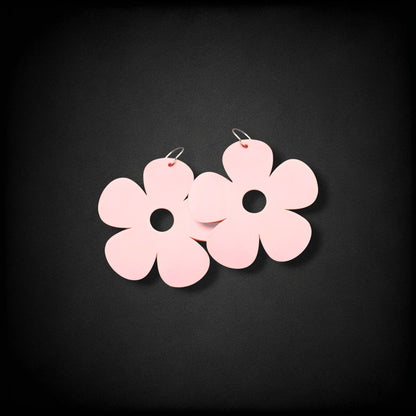 12th Ave Design Co. light pink bubble daisy earrings with five petals and a central cutout on modern metal hooks.