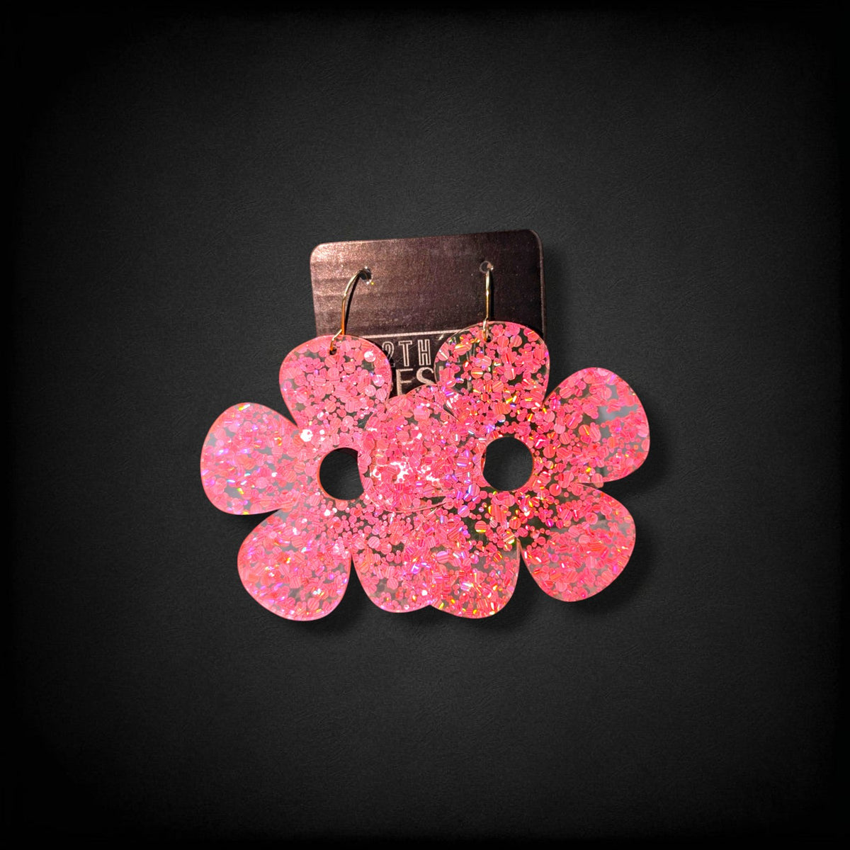 12th Ave Design Co. pink glitter bubble daisy earrings with 5 petals and gold-plated hooks on a display card.