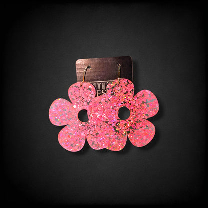 12th Ave Design Co. pink glitter bubble daisy earrings with 5 petals and gold-plated hooks on a display card.