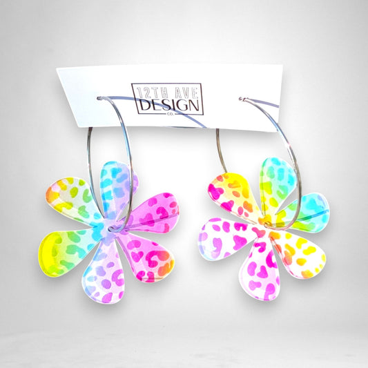 12th Ave Design Co. hoop earrings featuring colorful rainbow leopard print acrylic daisy charms on silver hoops.