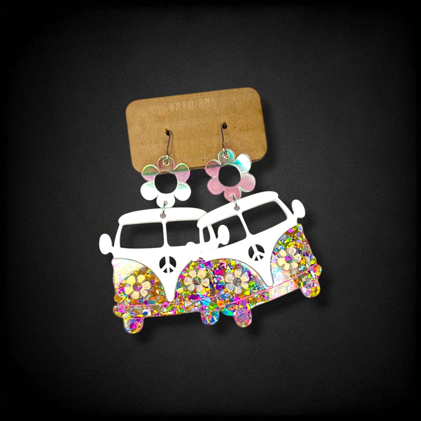 12th Ave Design Co. retro bus earrings in white acrylic with sparkling crystal daisy headlights and flower toppers.