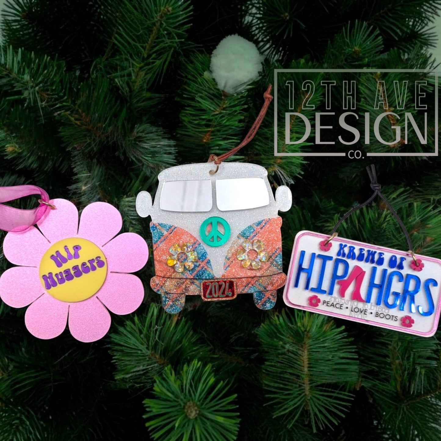 12th Ave Design Co. set of three retro-themed holiday ornaments featuring a pink flower, a glittery bus, and a sign.