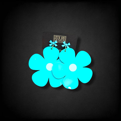12th Ave Design Co. bright turquoise bubble daisy earrings with small bow accents and modern gold-plated hooks.